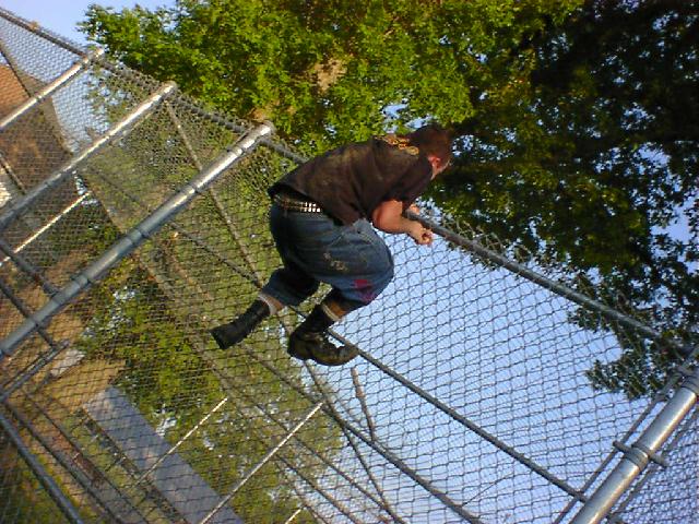 Psychopathic Kid is climbing the cage!...